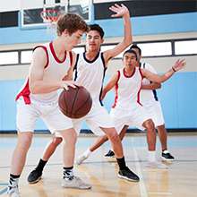 student playing basketball